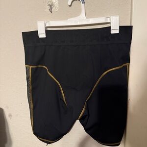 IVY PARK Black Shorts with Gold Trim